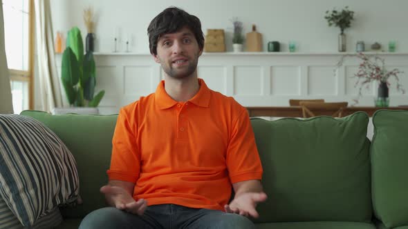 Man Talking Looking at Camera Making Video Call for Distance Job Interview alt