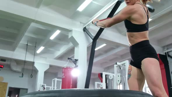 Girl Beats with a Hammer in Training alt