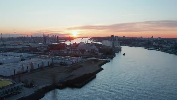 Warehouses and Industrial Buildings on the Banks of Elbe River in Hamburg Germany During Sunset alt