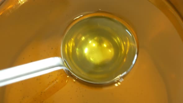 Sunflower Oil Organic Quality Bio, Mixing and Pouring in a Steel Barrel