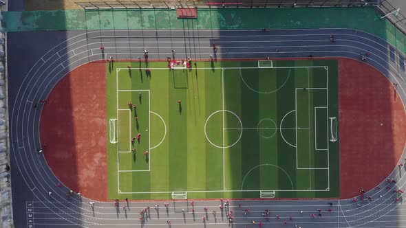 Aerial View of the New Football Field Stadium with Students