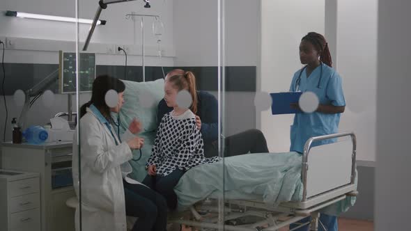 Paediatric Doctor Examining Chest Listening Heartbeat Using Medical Stethoscope alt