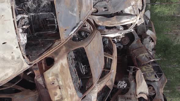 Vertical Video of a Dump of Destroyed Cars During the War in Ukraine alt