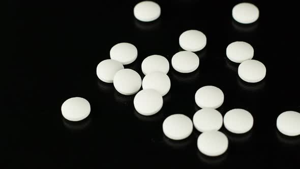 White medical pills rotating closeup. Pills and drugs. Pharmaceutical Industry. alt