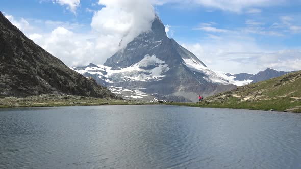 Scenic view on snowy Matterhorn peak and lake Stellisee