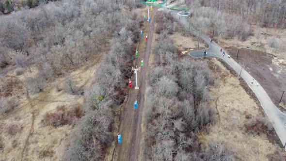 Aerial view on colored cableway cabins in spring