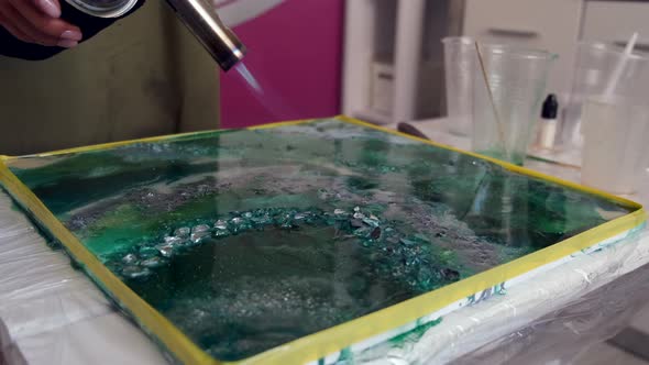 Cropped View of Artist's Hands Holding Paint Spray alt