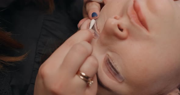 Lashmaker Does the Eyelash Lamination Procedure for the Client in the Beauty Salon Cosmetic Services alt