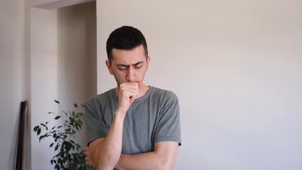 Sick Young Man Coughing Inside His House, COVID-19 Symptoms. - medium ...