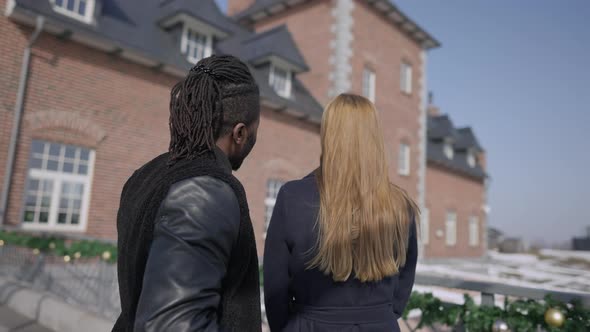 Rich African American Successful Man Showing Gift House to Caucasian Excited Woman alt