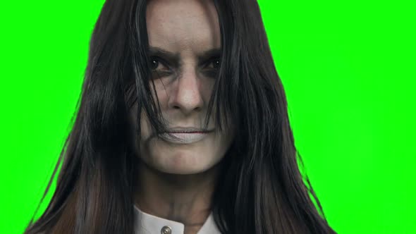 Demon in the Face of the Girl. Shooting on the Chroma Key. alt