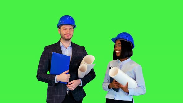 Happy Smiling Diverse Architects Builders After New Project Presentation Cheerful Hold Blueprint on alt