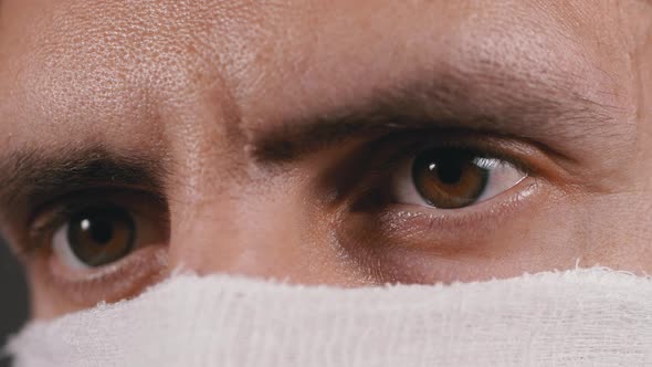 Portrait of Young Man in Protective Gauze Mask, Protection Coronavirus COVID-19 alt