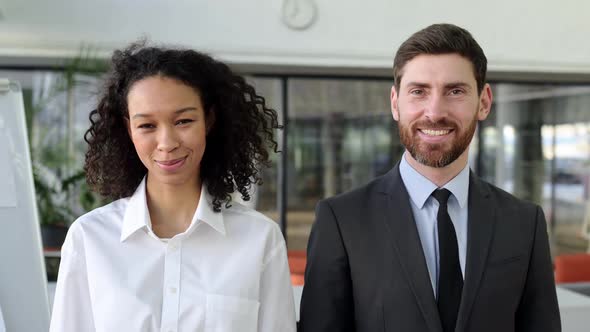 Two Successful Multiracial Colleagues Company Cofounders Directors Managers a Caucasian Man and an alt