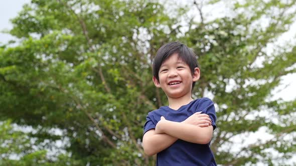 Close Up Of Happy Asian Child Outdoor Slow Motion  alt