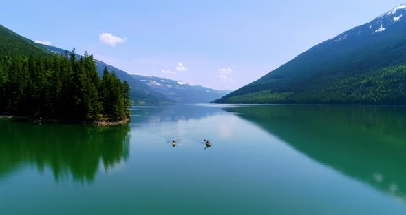 People kayaking in lake  alt