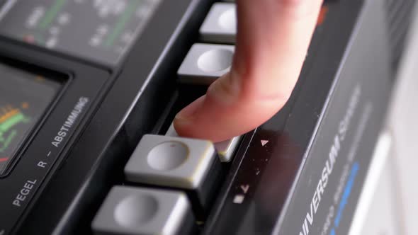 Pushing Play Button on a Vintage Tape Recorder. Transistor Retro Radio alt