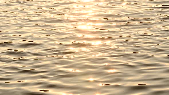 the surface of the sea with sun rays