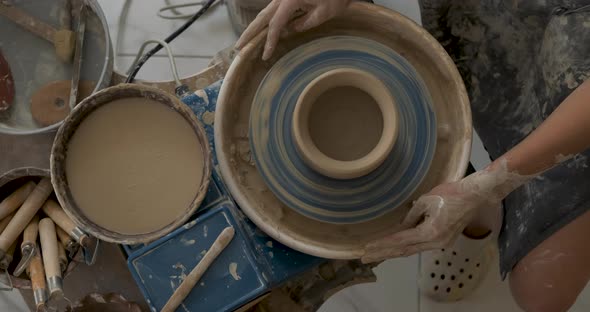 Flat Lay of Potter Master at Work in Clay Studio Handmade Process of Creating Pot on a Pottery Wheel