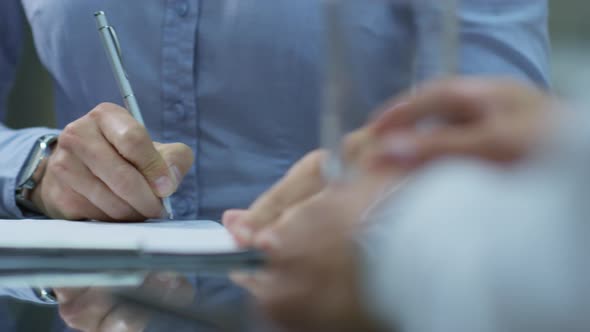 Closeup of Male Hands Sighing Business Agreement alt
