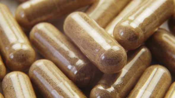 Pills Capsules with Biologically Active Additives Rotation Macro Shot alt