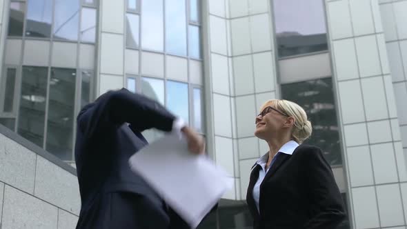 Extremely Happy Male and Female Colleagues Throwing Papers, Celebrating Success