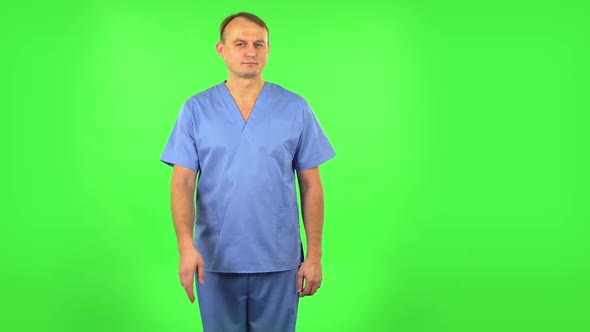 Medical Man Flirts, Blows a Kiss and Winks. Green Screen alt