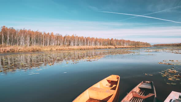 Lake Or River And Old Rowing Fishing Boats In Beautiful Autumn Sunny Day alt