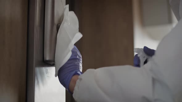 Handheld video of hands disinfecting elevator buttons. Shot with RED helium camera in 8K. alt