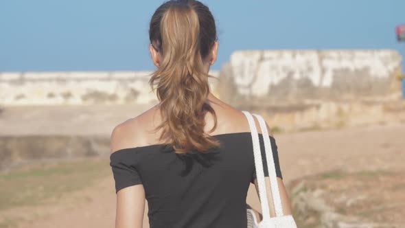 Girl Gets Acquainted with Ancient Fort Sights Walking alt