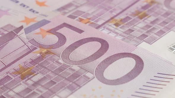 Slow tilt over row of 500 euro banknotes 4K 2160p 30fps UltraHD    footage - Close-up of five hundre alt