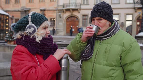 Senior Couple Tourists Grandmother Grandfather Drinking From Thermos Enjoying Hot Drink Tea Coffee alt