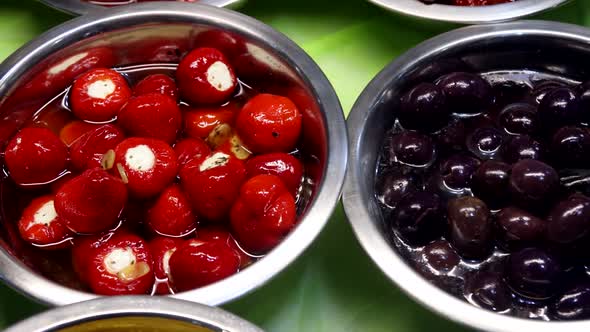 Pickled Olives with Different Fillings Pepper Stuffed
