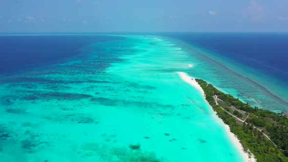 Aerial top view scenery of beautiful bay beach voyage by shallow ocean with white sandy background o alt