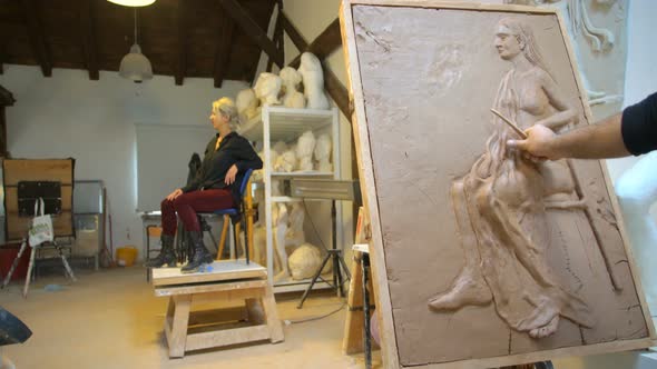 Sculptor is Modeling a Realistic, Figurative Relief with Model