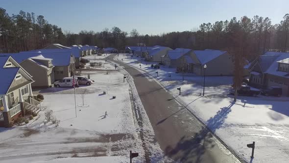 houses and roads covered with snow alt