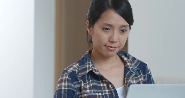 Woman use of computer at home alt