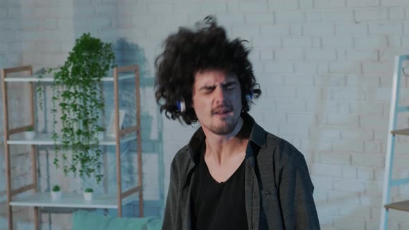 Guy Listening to Music Dancing  Singing and Playing Air Guitar Happy and Crazy alt