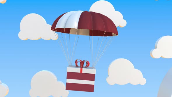 Carton with Flag of Latvia Falls with a Parachute alt