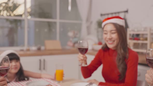 Asian lovely family member feel happy and excited to celebrate christmas party together in house. alt