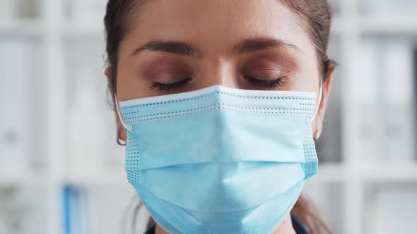 Professional medical doctor working in hospital office. Young and attractive female physician. alt