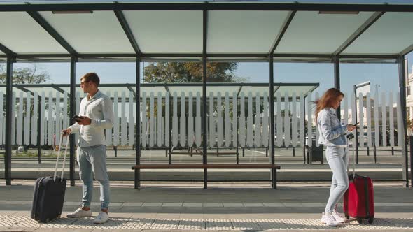 People are Standing at a Public Transport Stop alt