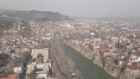 Aerial view of Metekhi church in old Tbilisi located on cliff near river Kura. Georgia 2021 winter alt