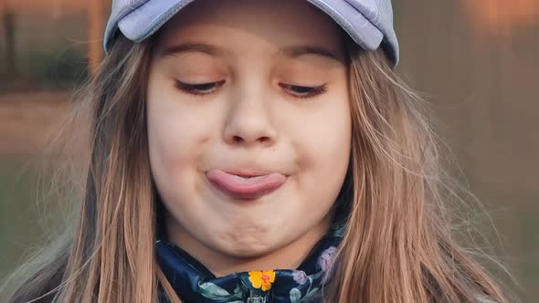 Little Girl Shows Tongue, Stock Footage | VideoHive