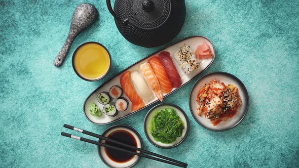 Asian Food Assortment. Various Sushi Rolls Placed on Ceramic Plates alt