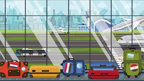 Suitcases with Egyptian Flag Stickers on Baggage Carousel alt