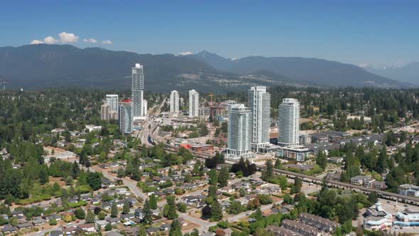 Aerial View Of Area Around Burquitlam Station In Coquitlam, British Columbia, Canada With Mountainou alt