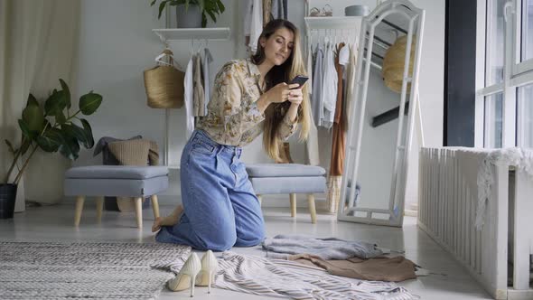 Young Stylist Take Photo Clothes on Floor