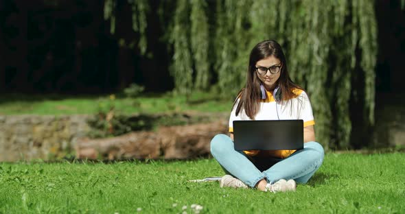 Woman Working on Laptop