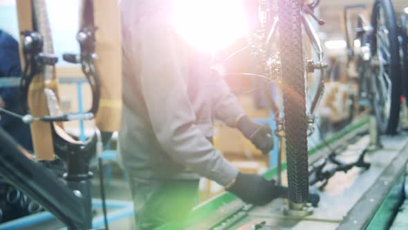 Bicycle Is Getting Manufactured By a Factory Technician alt
